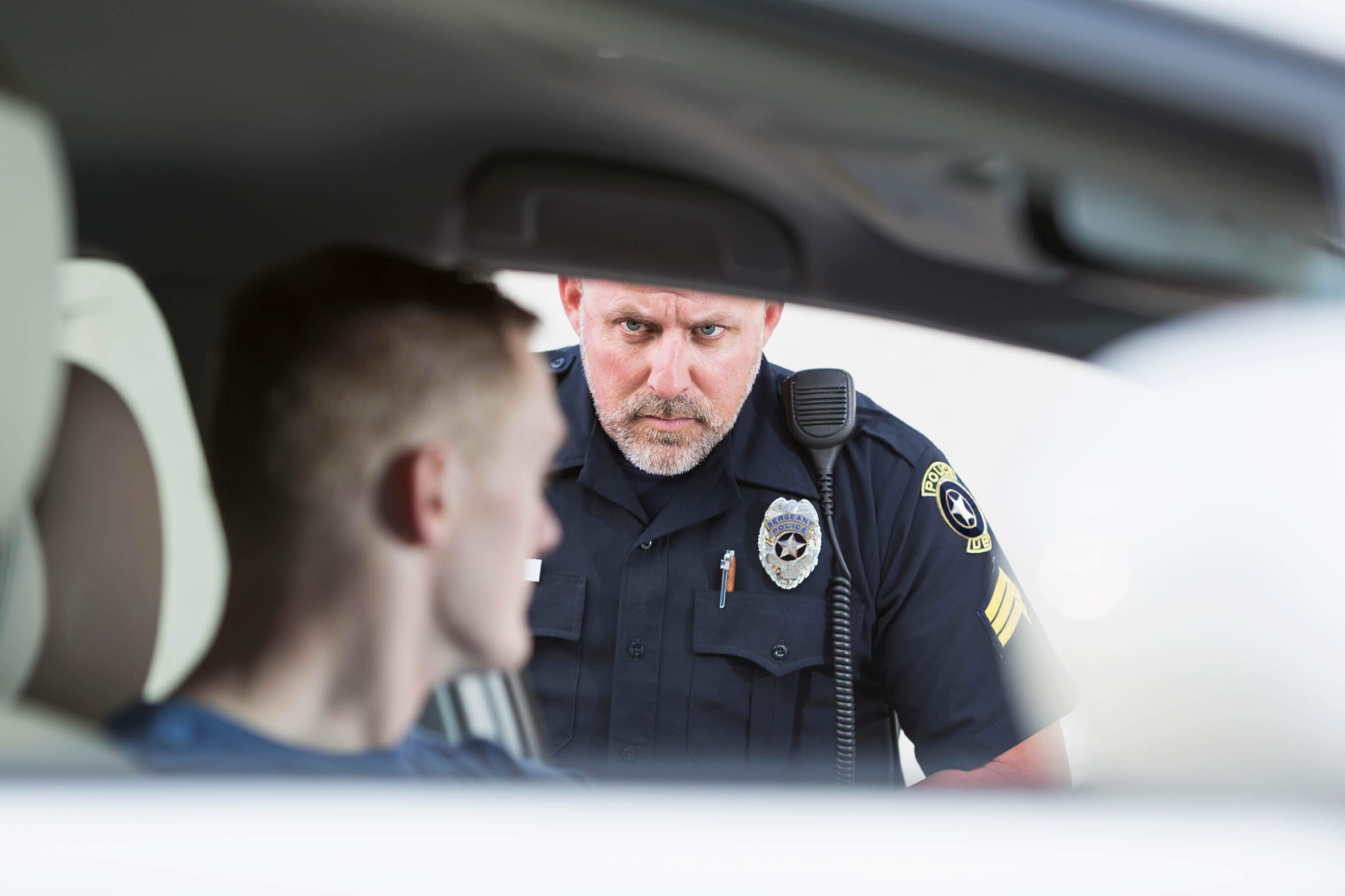 Policeman stopping a driver - checkpoints California